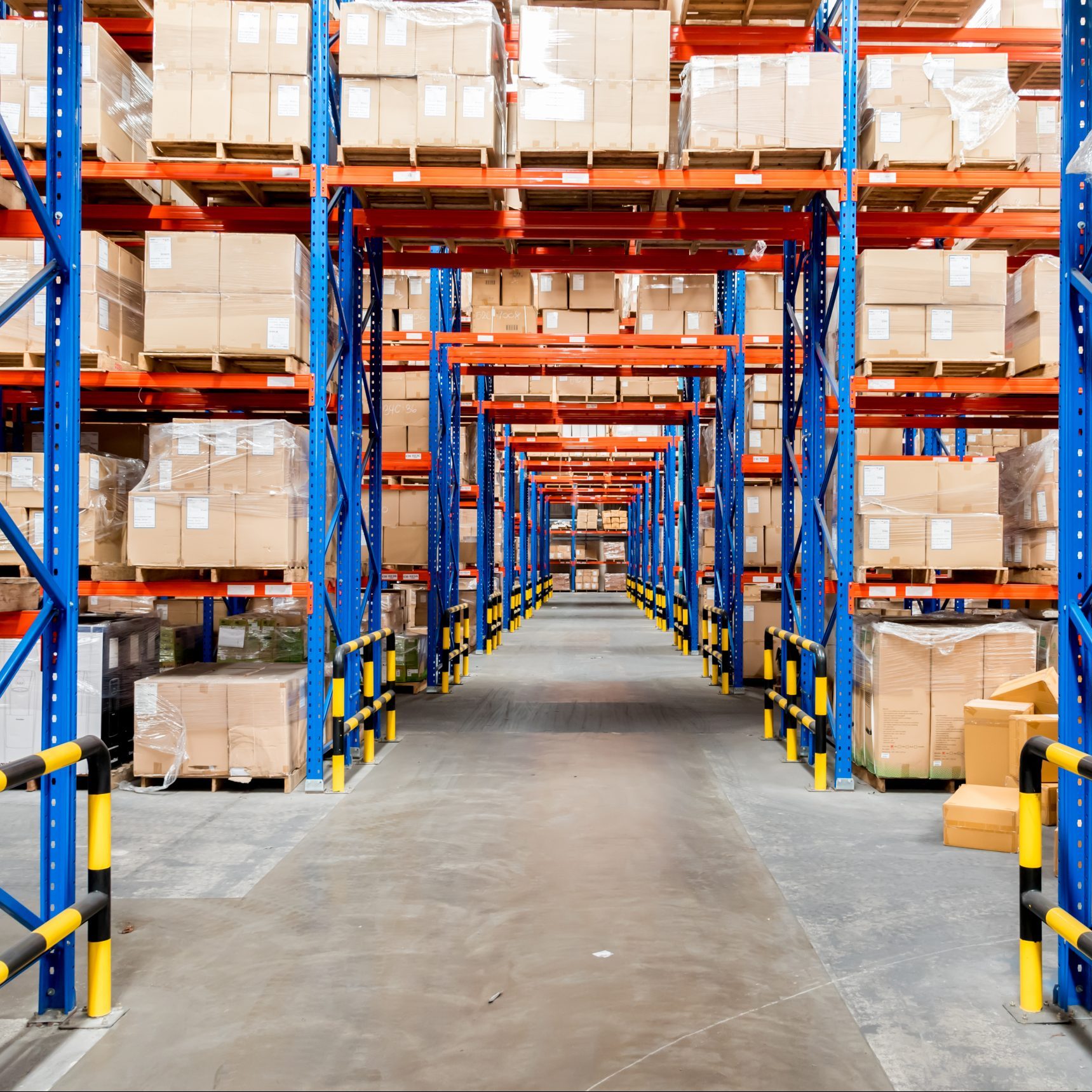 Warehouse showing rows of shelving and packages
